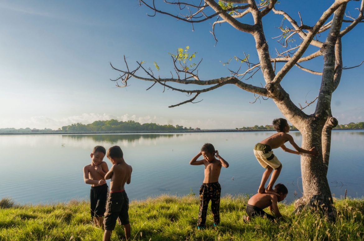 five-boys-standing-near-body-of-water-1633417-scaled.jpg