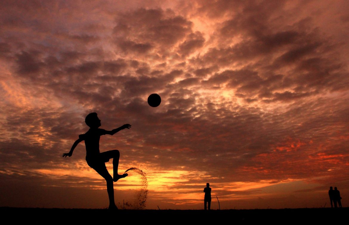 silhouette-of-a-boy-playing-ball-during-sunset-978695-scaled.jpg