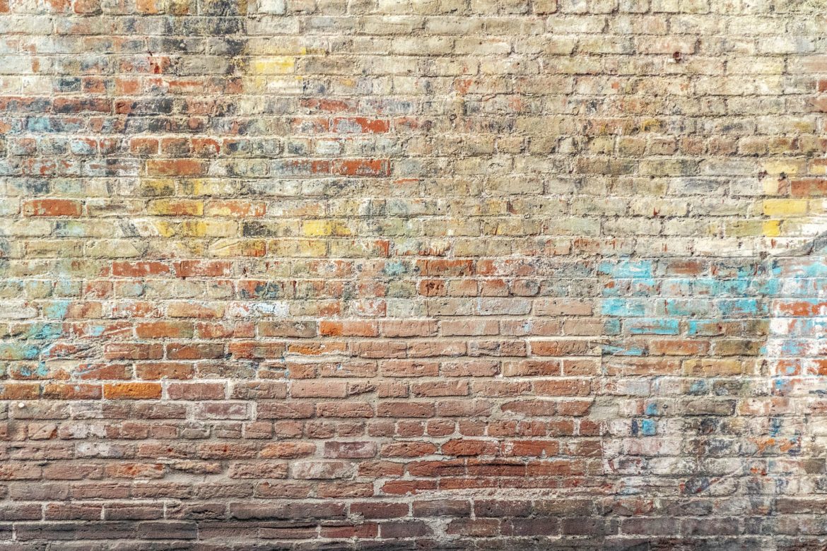 closeup-photo-of-brown-brick-wall-1227511-scaled.jpg